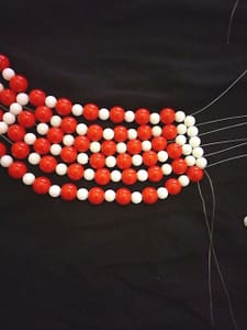 White beads across photo
