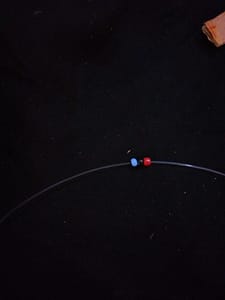 Three beads in a thread 