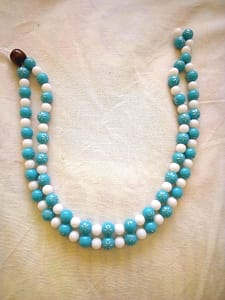 A necklace blue and white beads