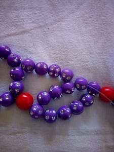 Passing the four beads through the fourth bead