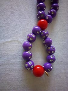 Left thread passing through three beads