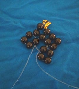 More beads and strings to form a necklace photos