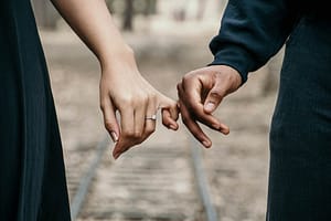 Holding hands sign